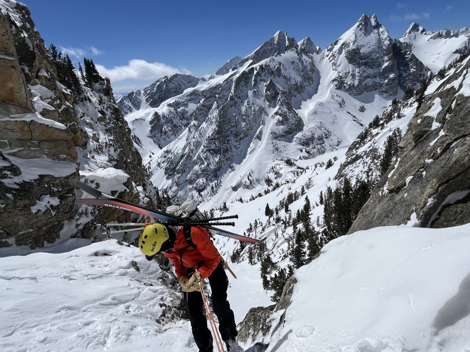 Person hiking with skis in the mountains