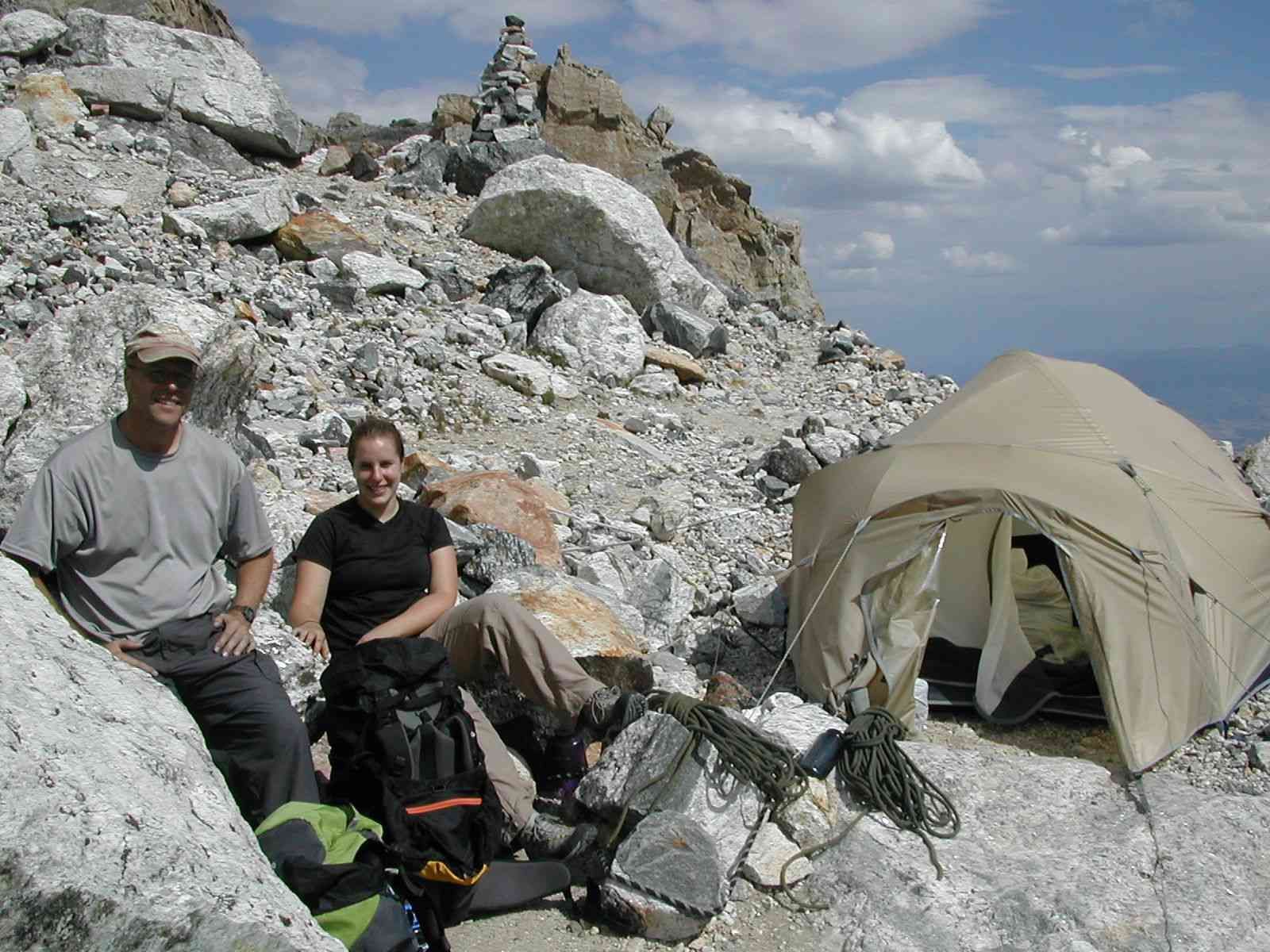 Climbers with their tent on mountain top
