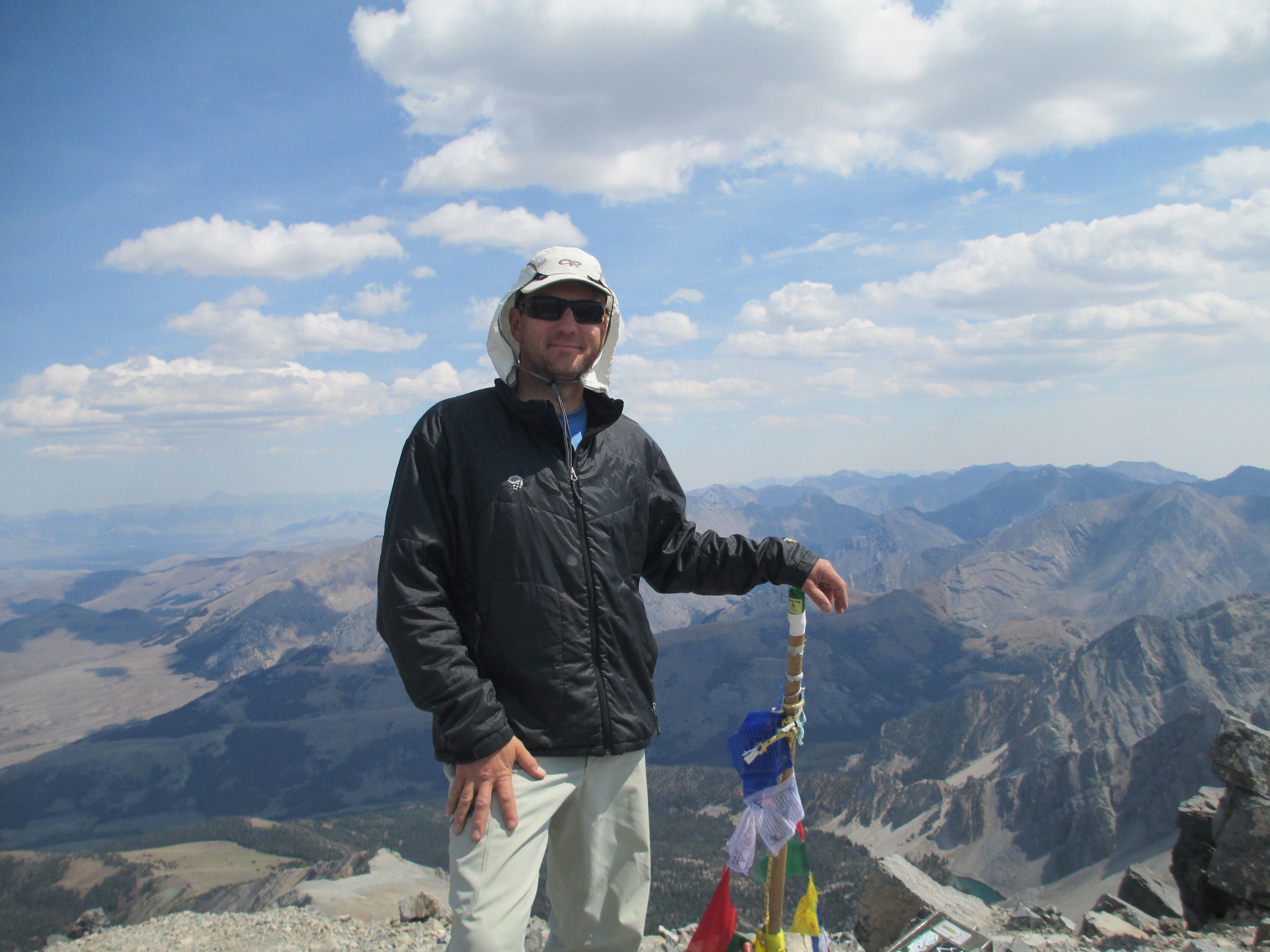 Climber at summit of mountain 