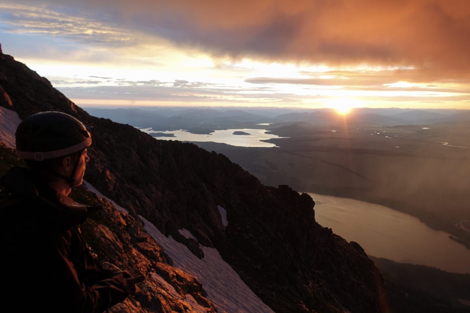 Climber watching sunset at the Tetons 