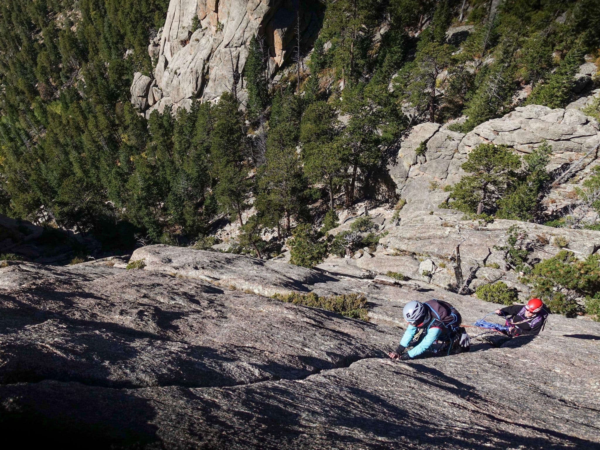 Pair mountain climbing in Rocky Mountain national park 