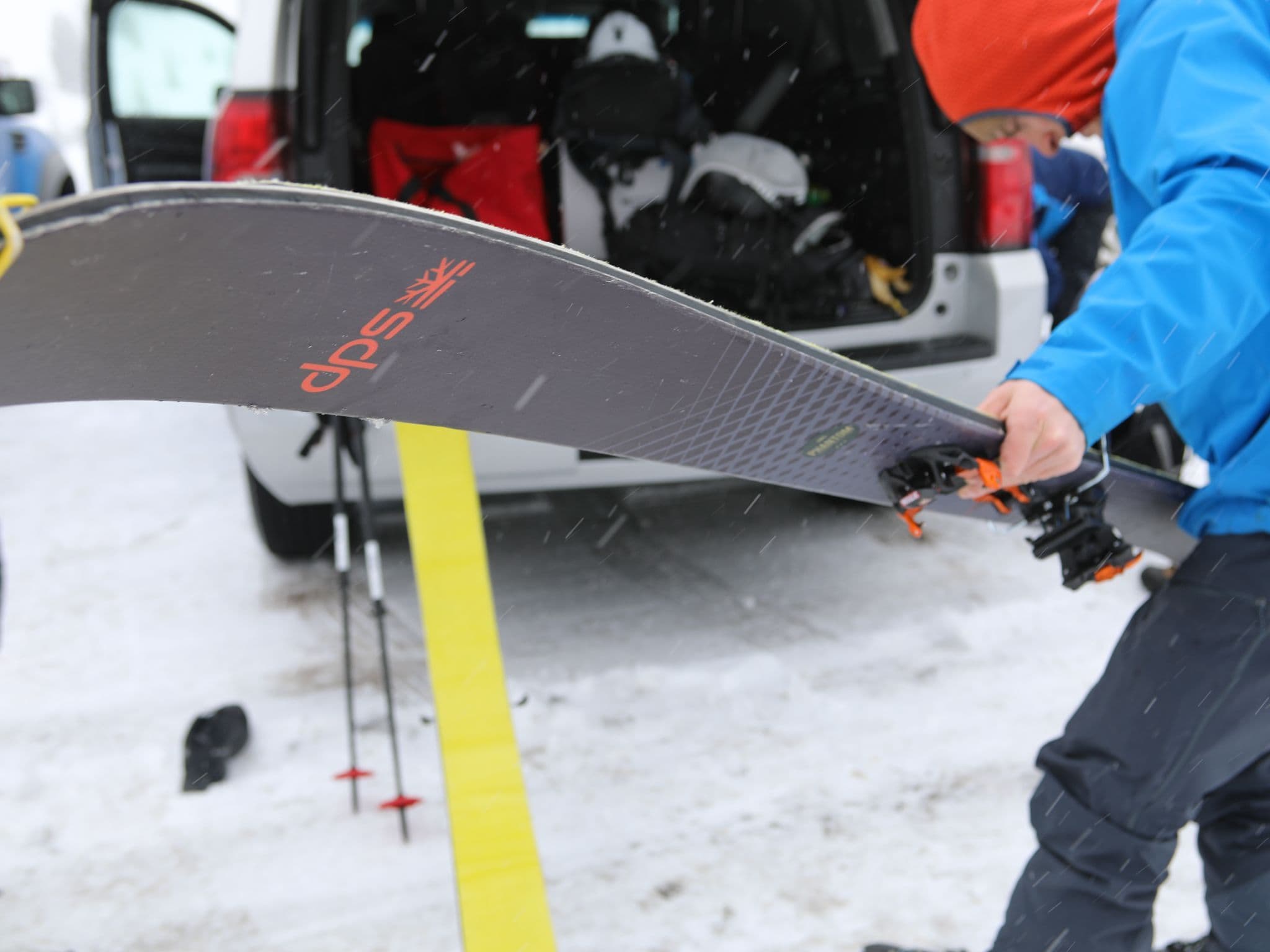 Unloading skis from truck