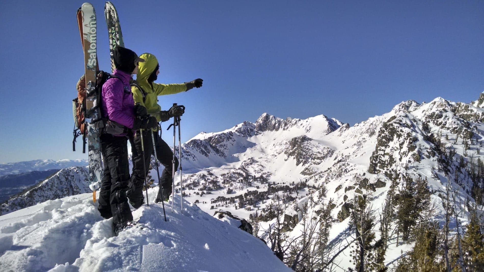 Backcountry skiers observing the landscape 