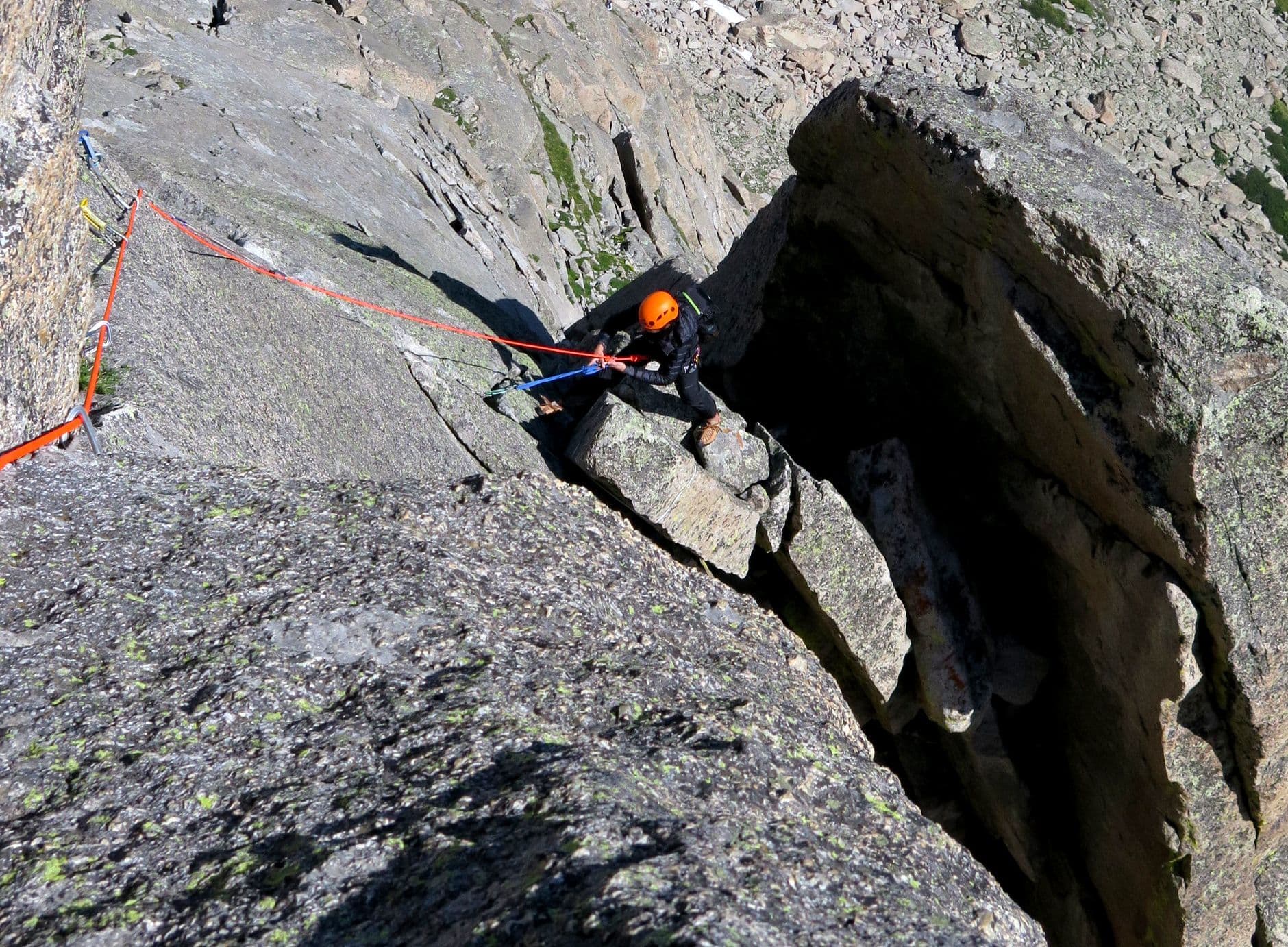 Person climbing through rocky terrain 