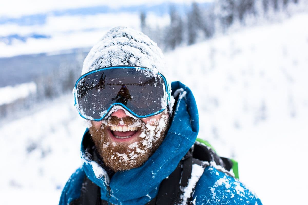 Man happy while covered in snow 