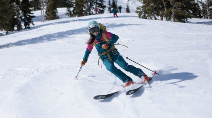 Skier carves down mountain