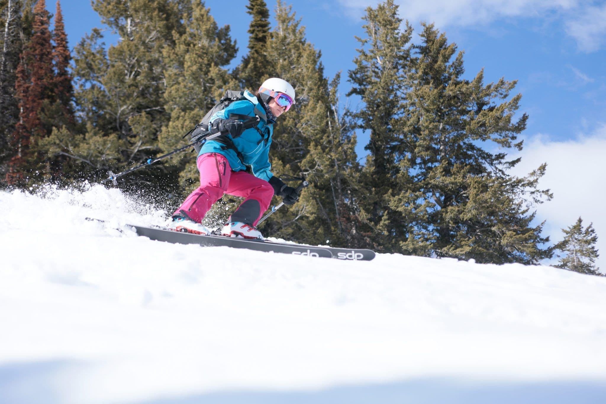 Women carving down a mountain 