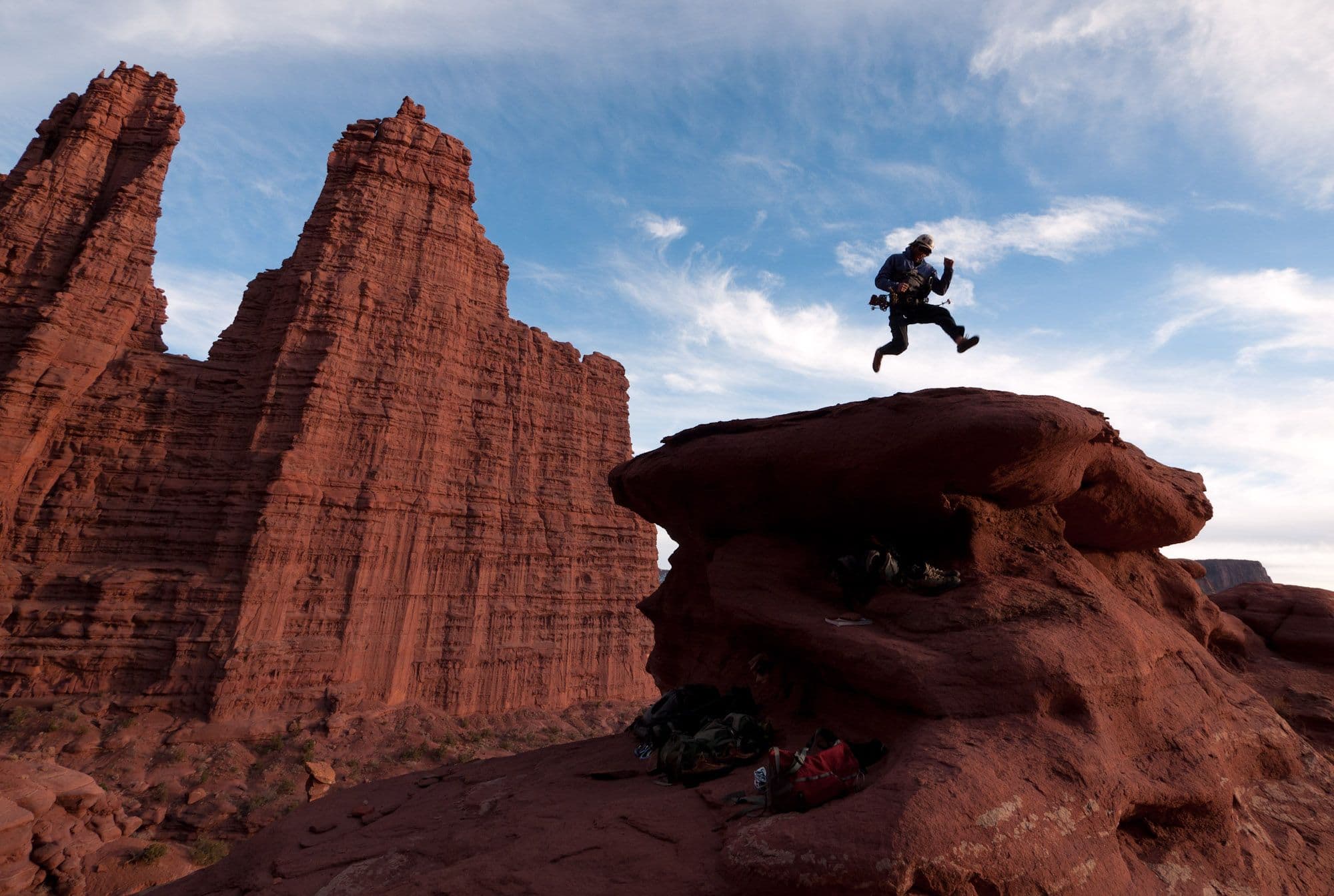 Man jumping in front of canyon in Moab Utah