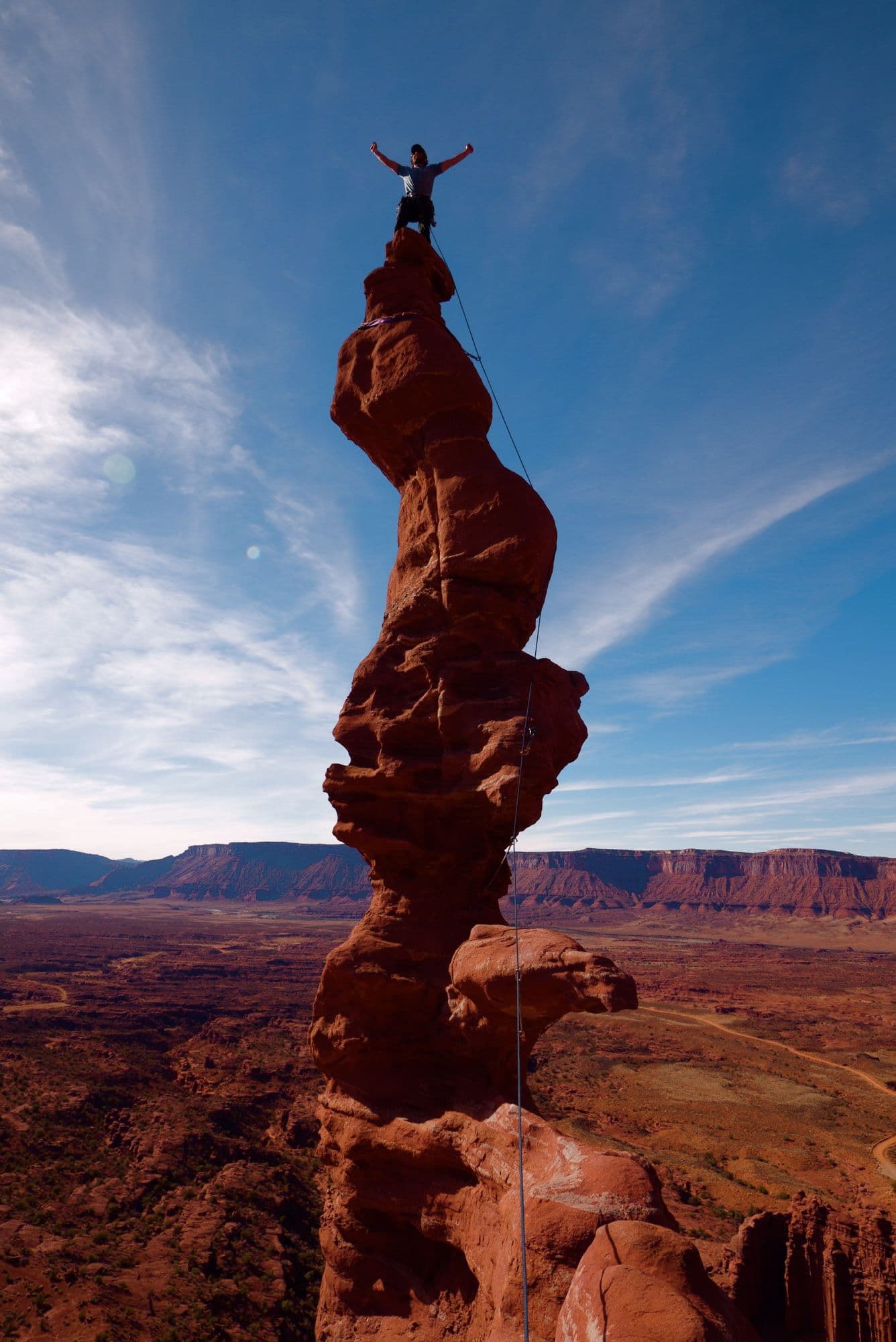 Man on top of Tower in Moab Utah