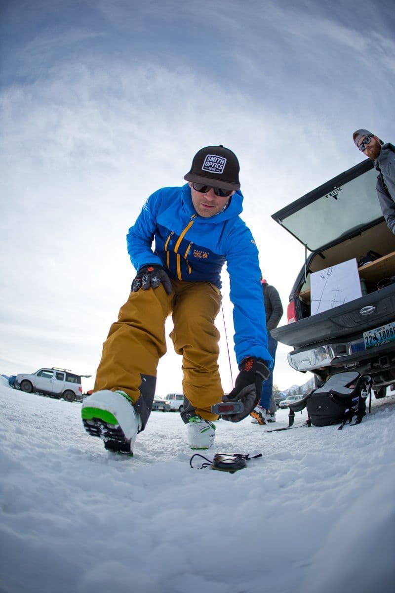A man using a avalanche transceiver