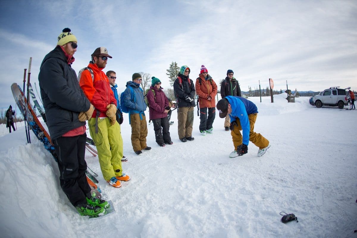 Skiers watching a demonstration