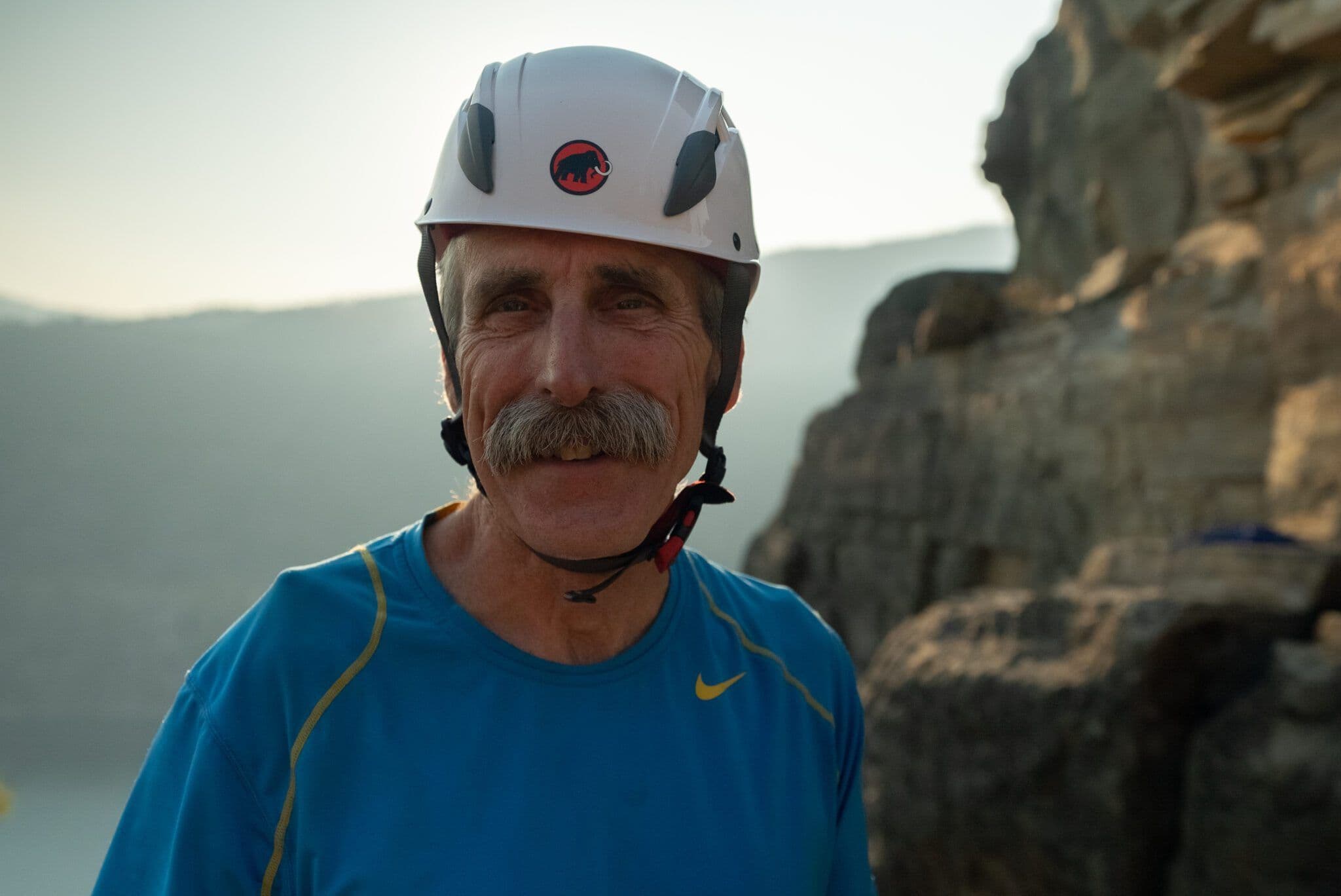 Man on top of mountain