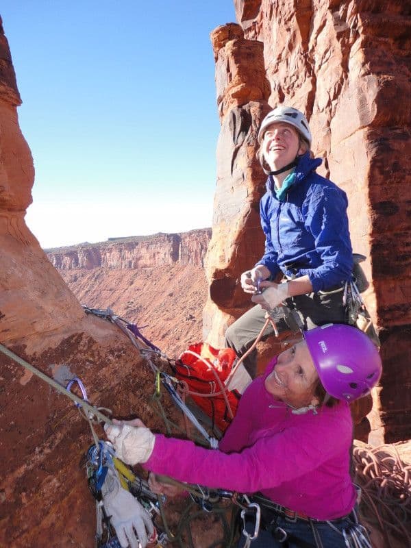 Two women enjoying their climb in Moab