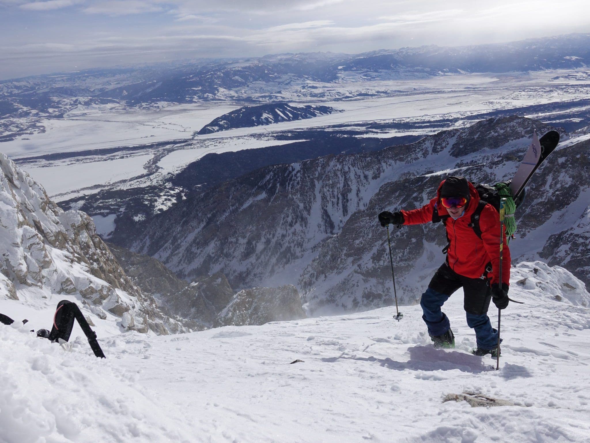Skier climbing to top of mountain