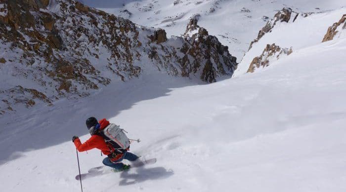Person skiing down powder in Grand Teton national park