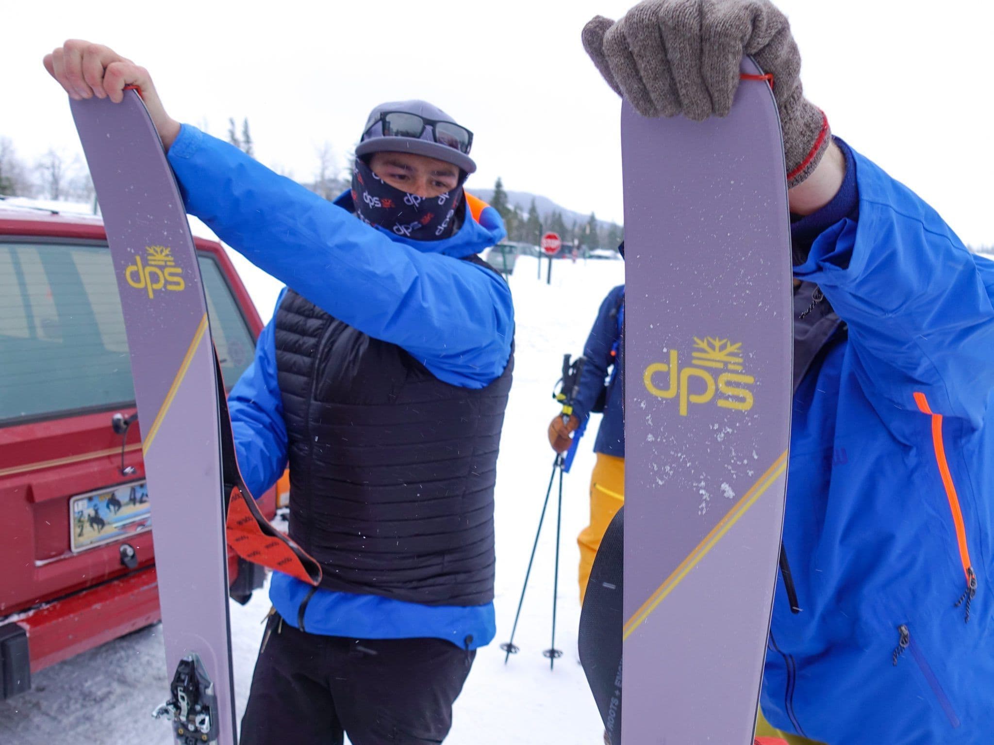 Two skiers getting ready
