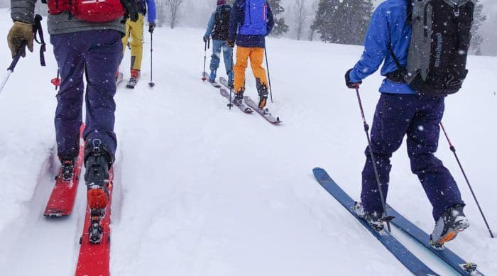 Skiers hiking in avalanche course 