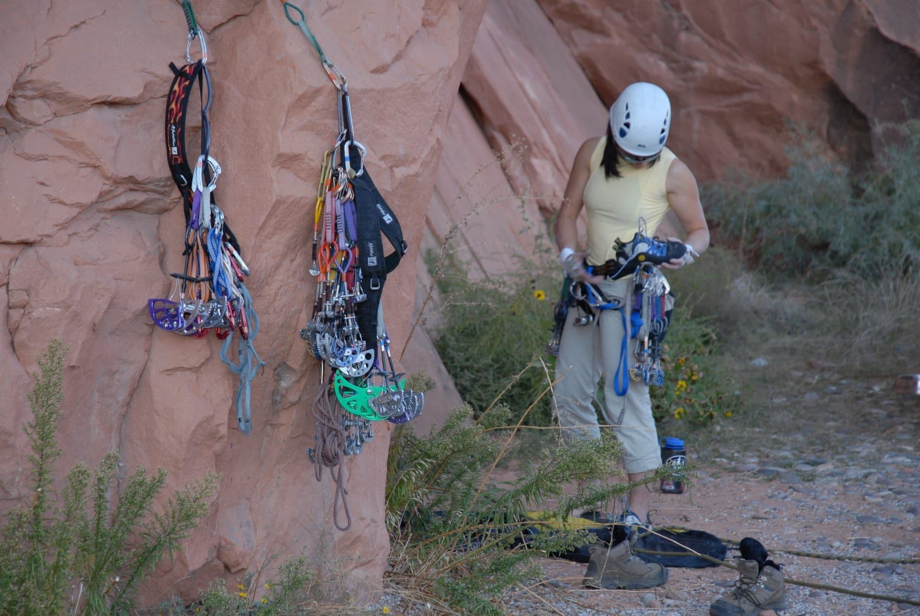 Woman preparing to rock climb 