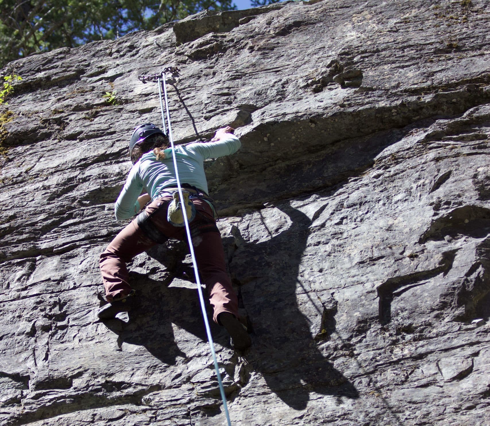 Rock climber scaling a mountain