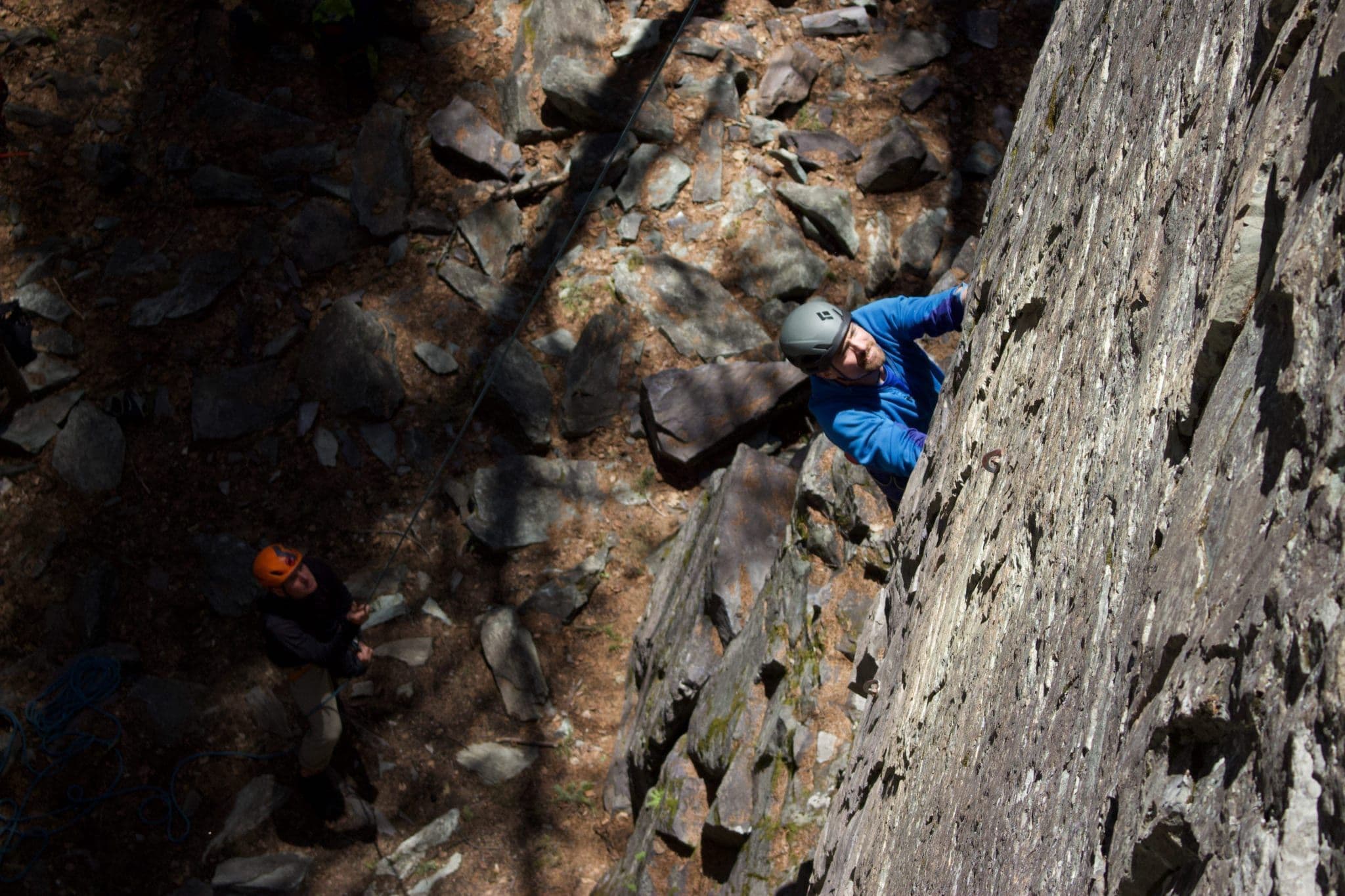 Two people rock climbing