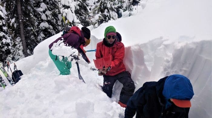 Multiple People shoveling snow