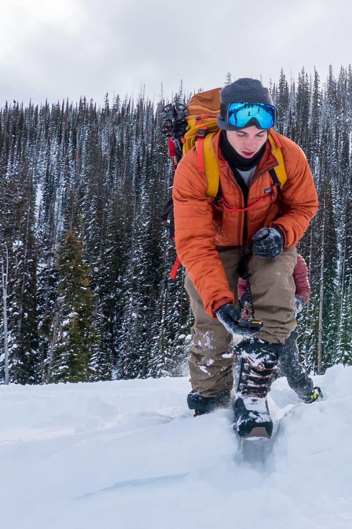 Person hiking a snowy mountain
