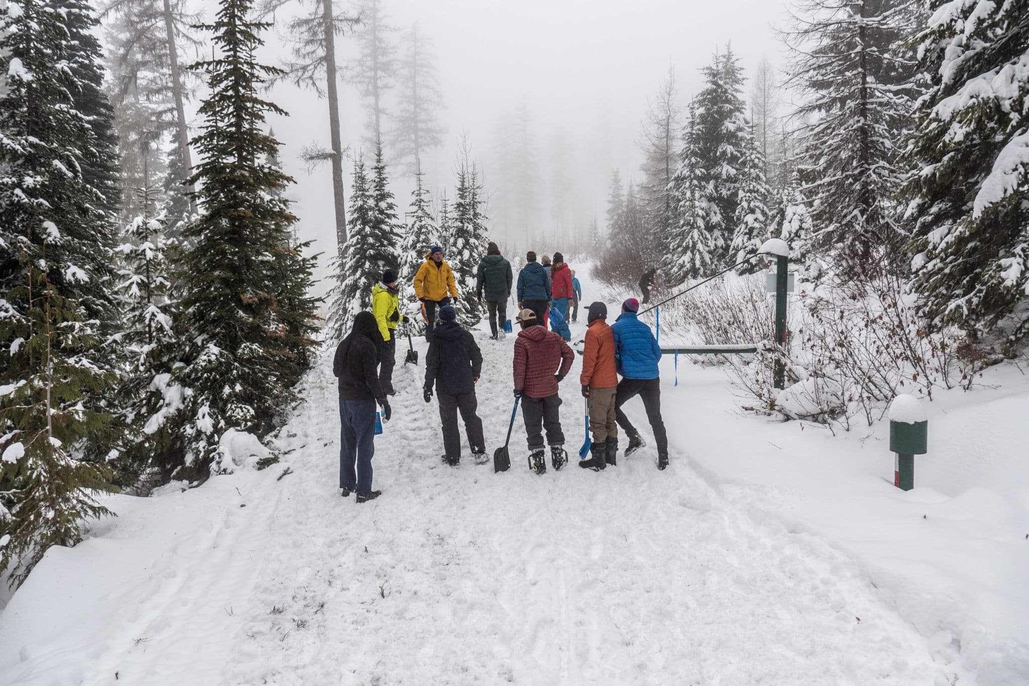 Group members listen to avalanche course