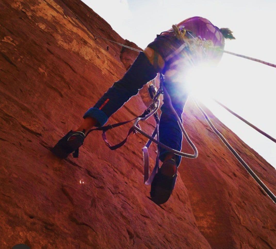 Person canyoneering down