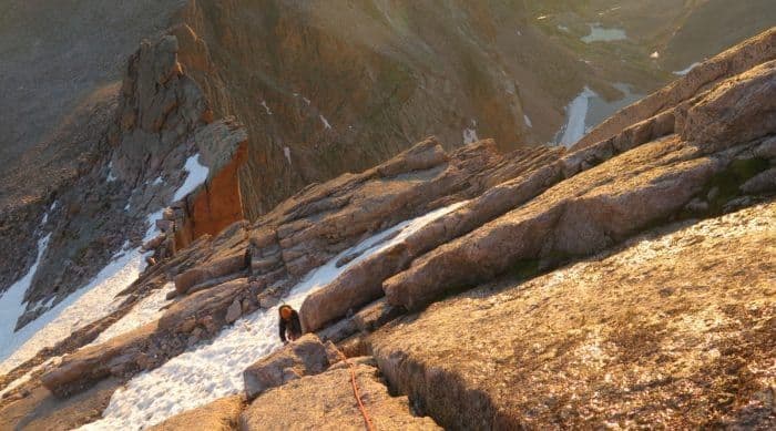 Person Rock climbing longs peak