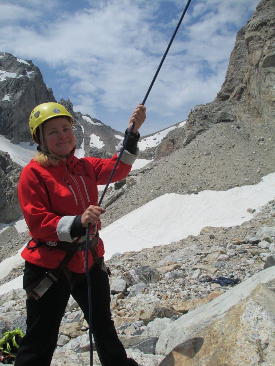 Person assisting in rock climbing 
