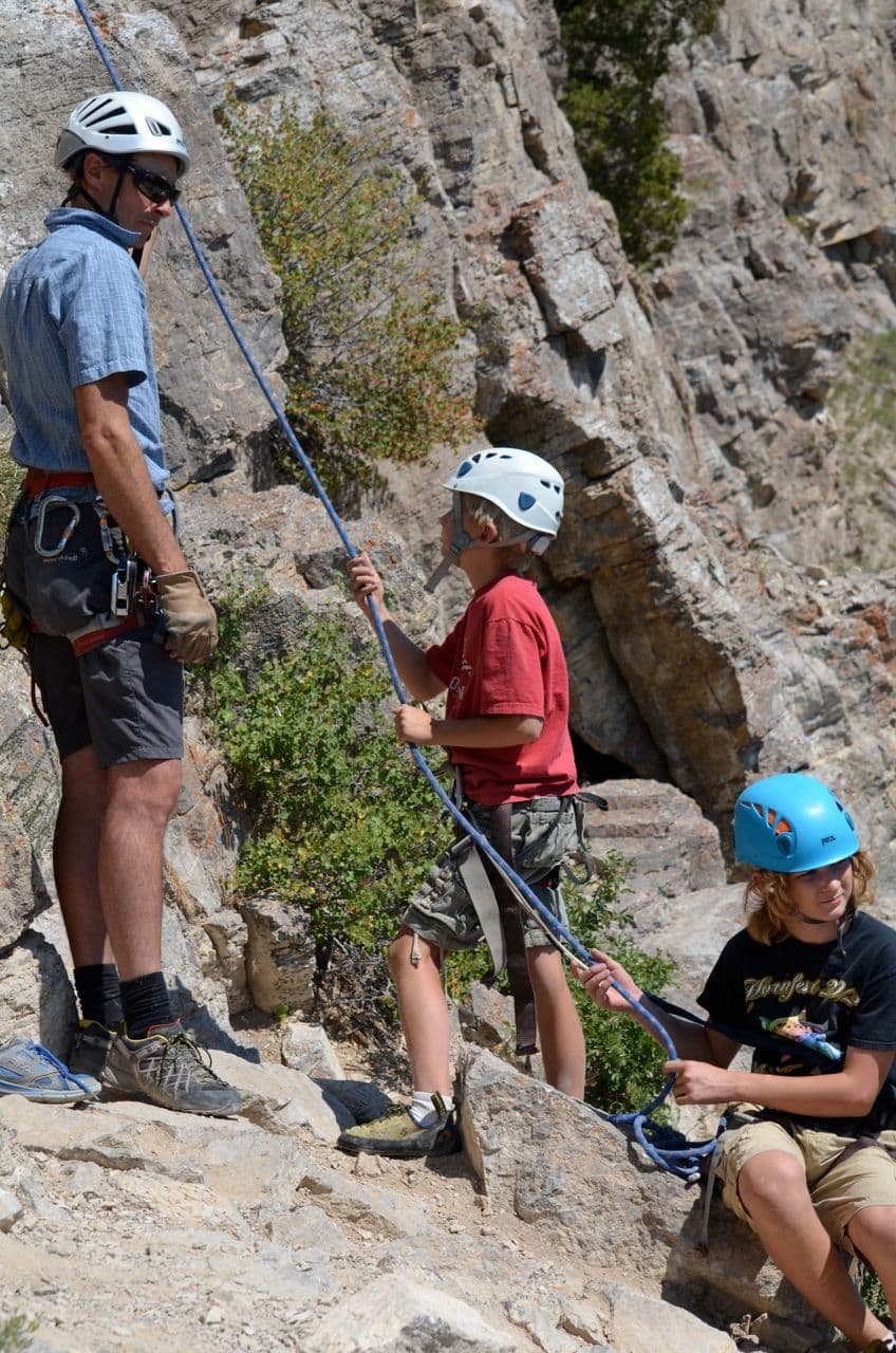 Kids learning to rock climb