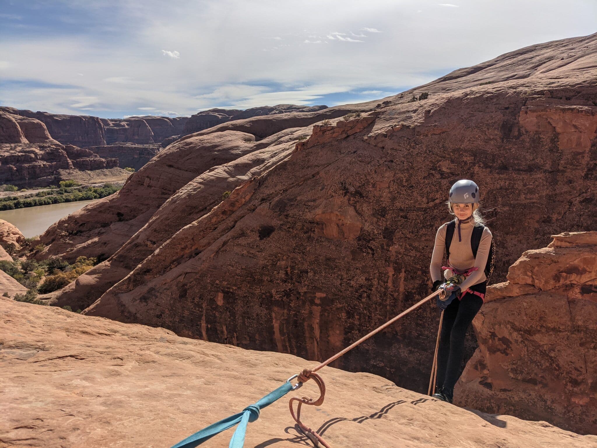 Girl getting ready to go down a mountain 