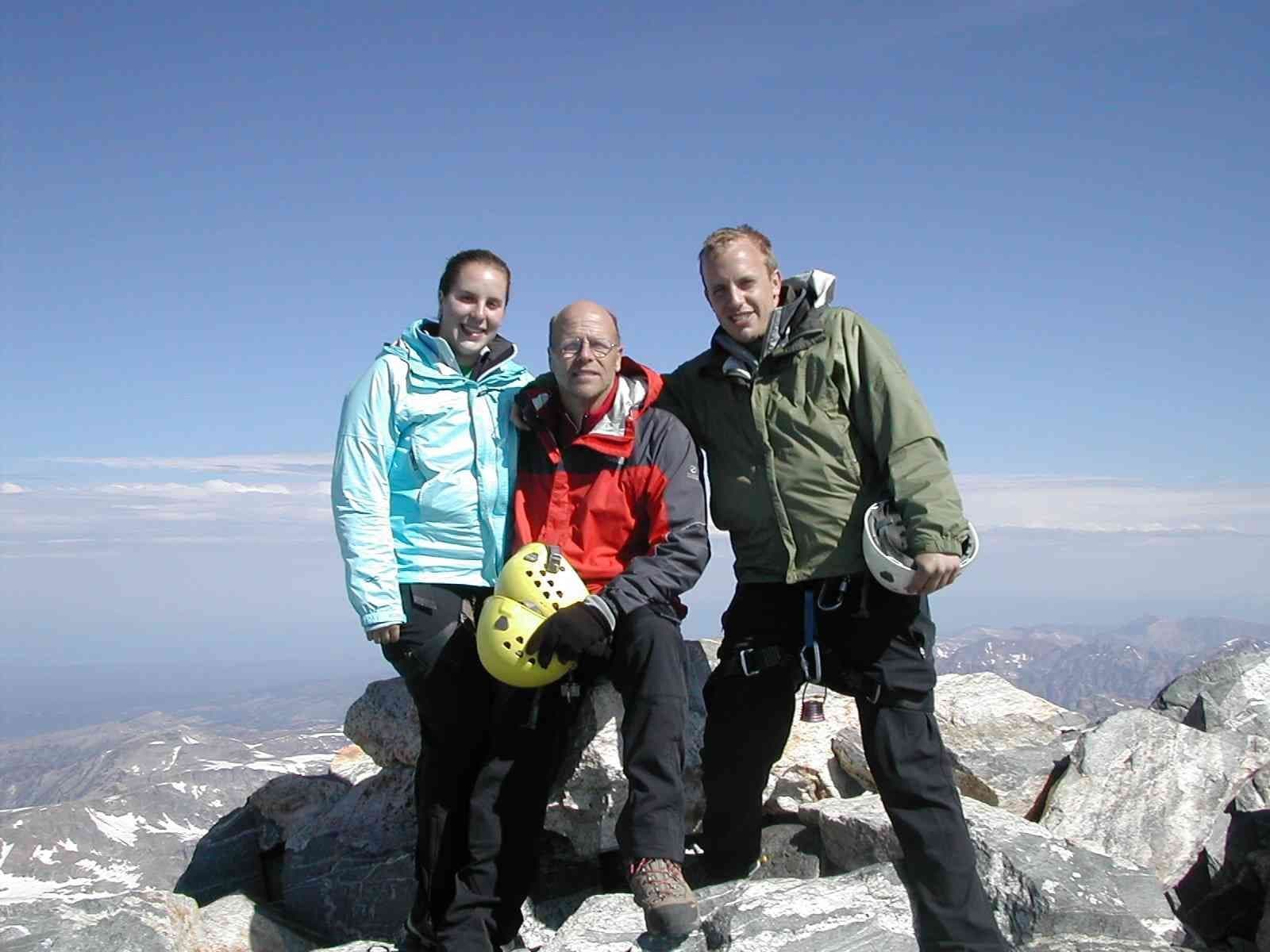 Group photo of happy climbers at the summit