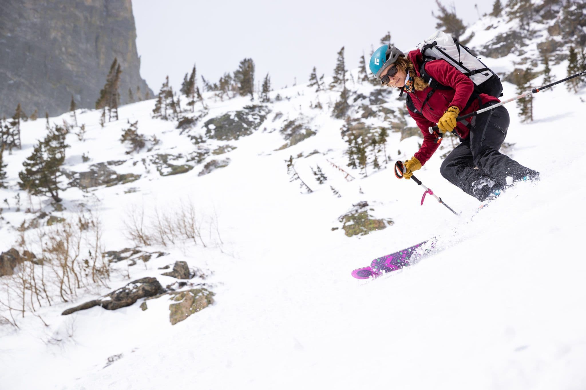 Person skiing down deep powder 