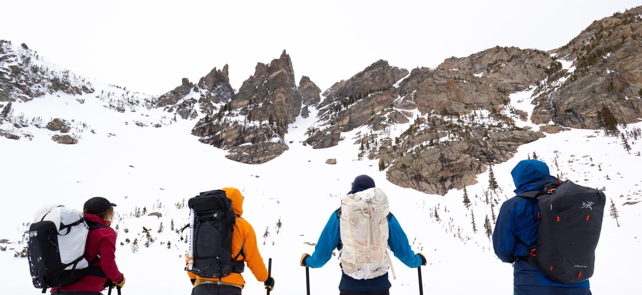 Group of skiers preparing to climb a mountain 