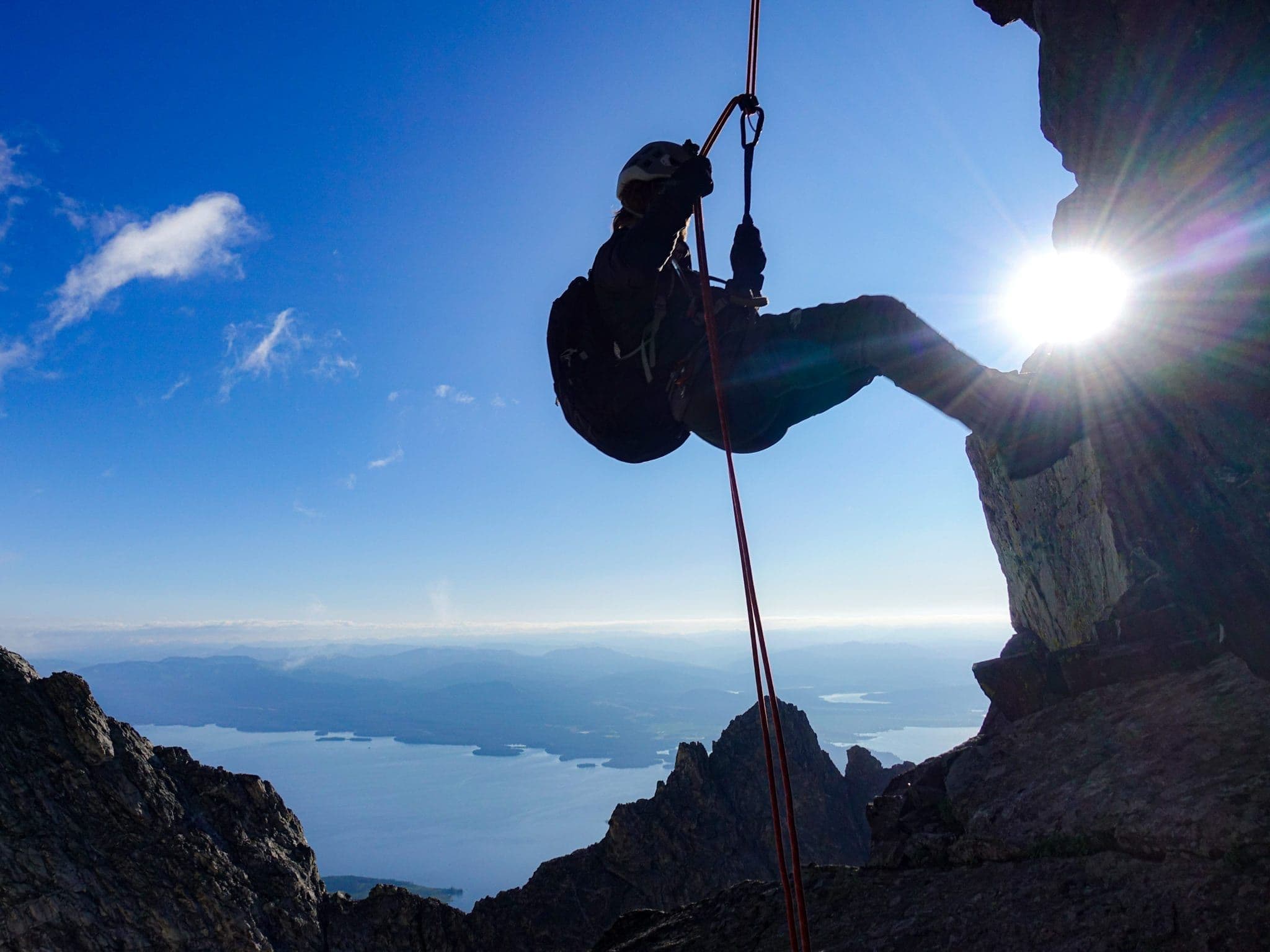 Person scaling Mount Moran
