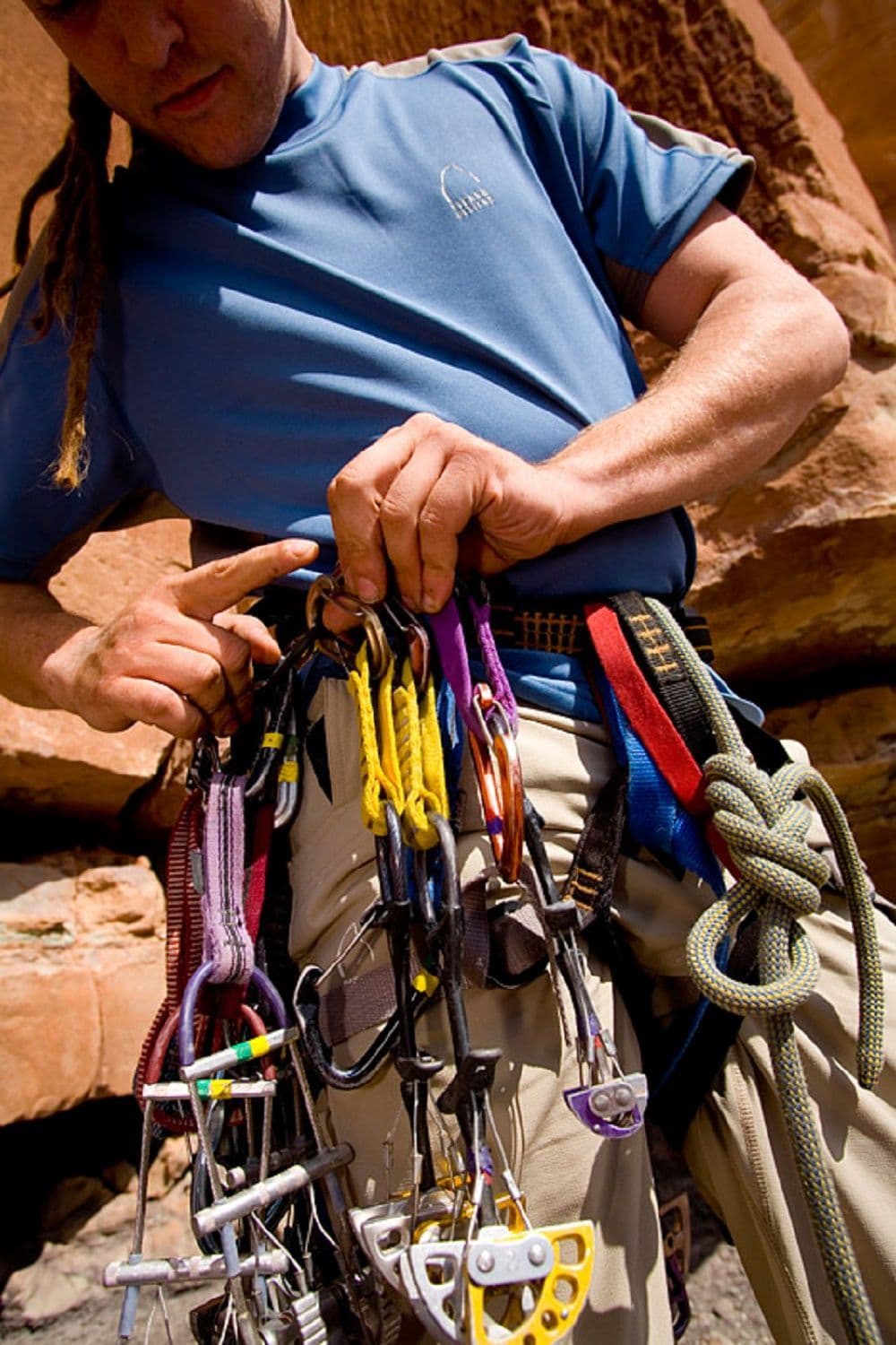 Person showing climbing gear 