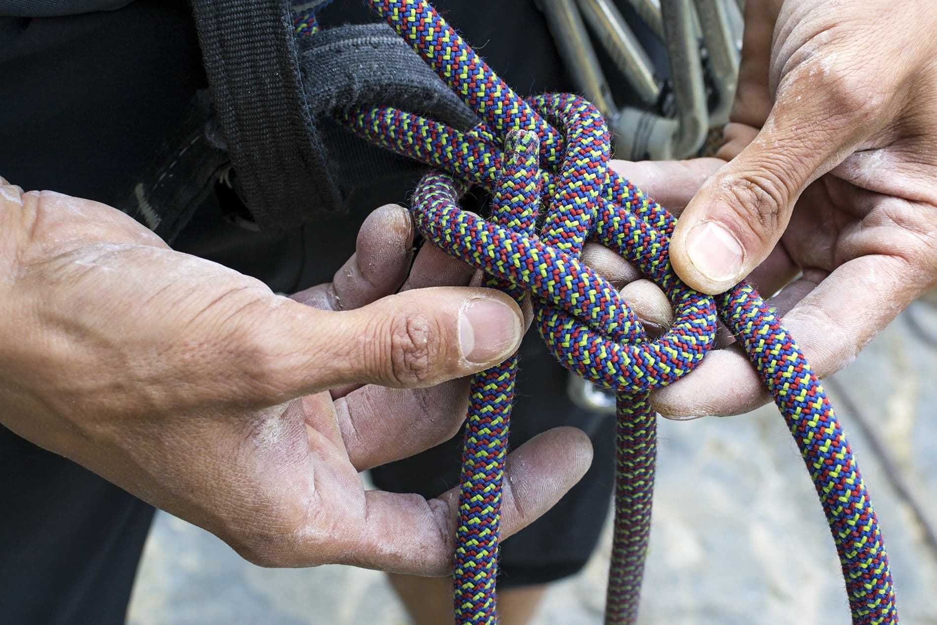 Climber tying a figure 8 knot 