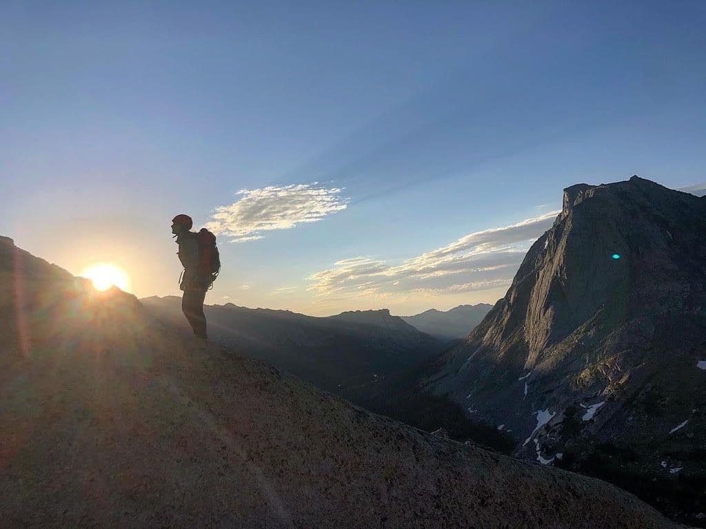Hiker watching sunset at wind river range