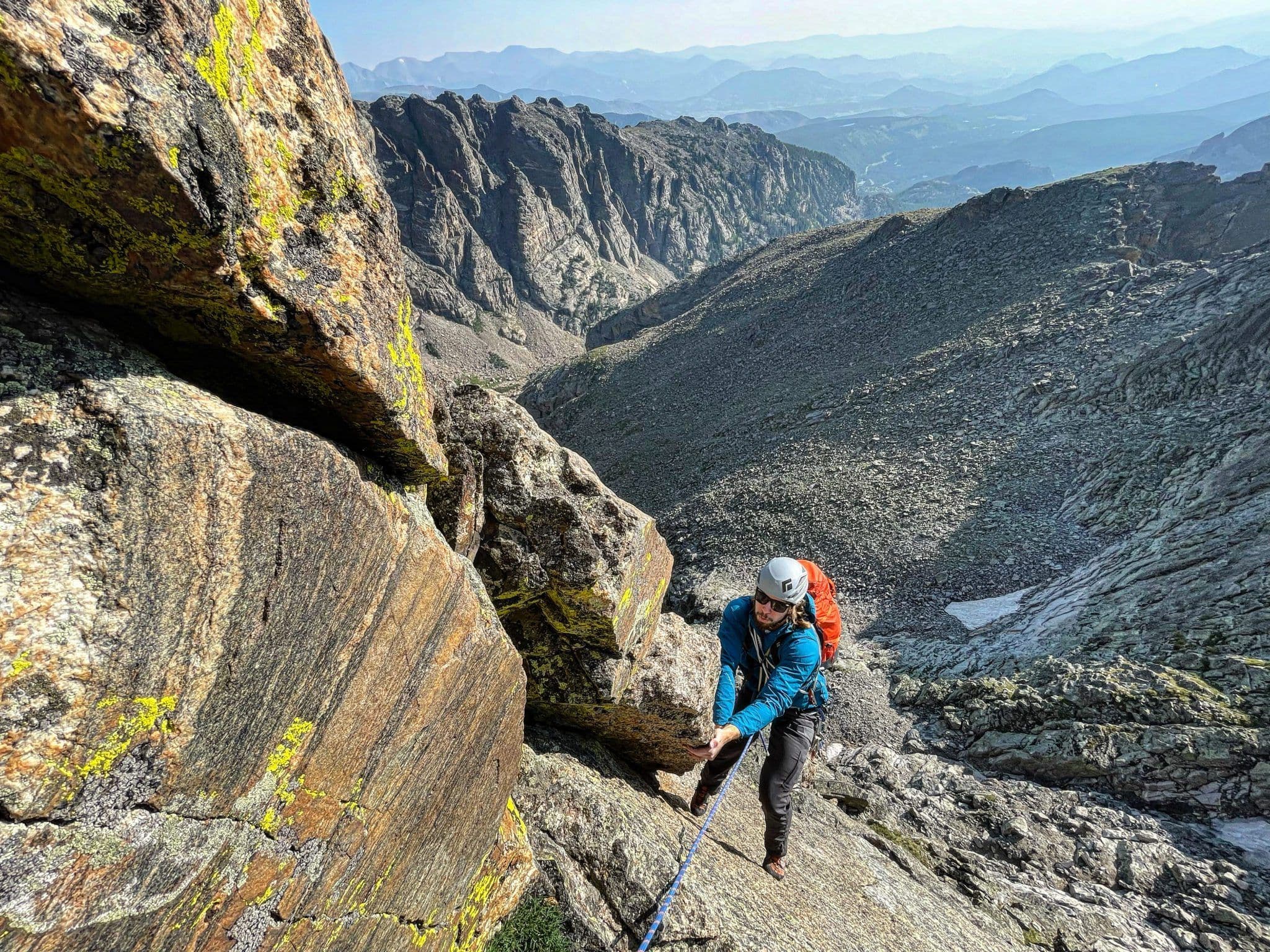 Person mountain climbing in rocky mountain national park