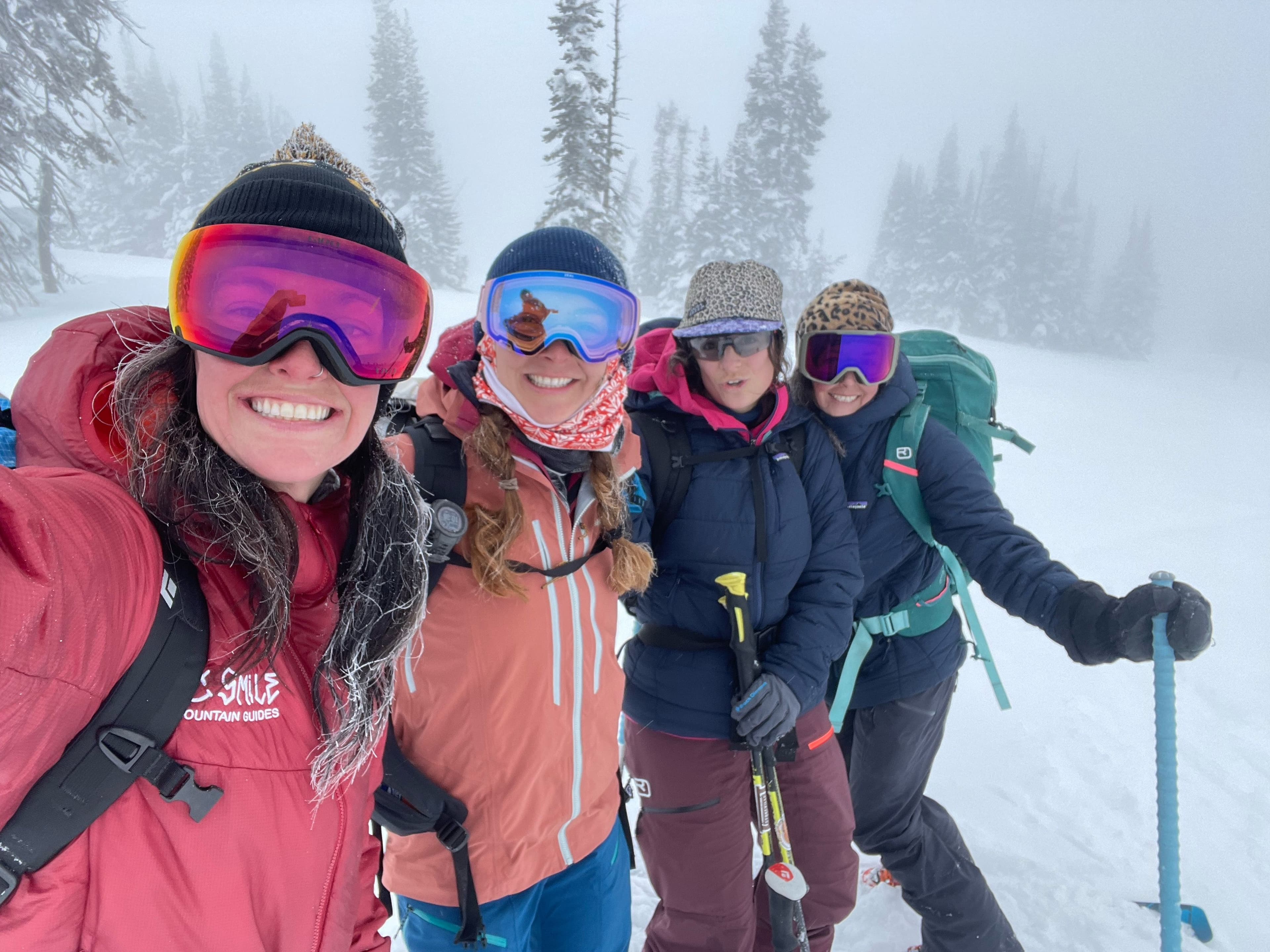 Women demonstrating the depth of the snow