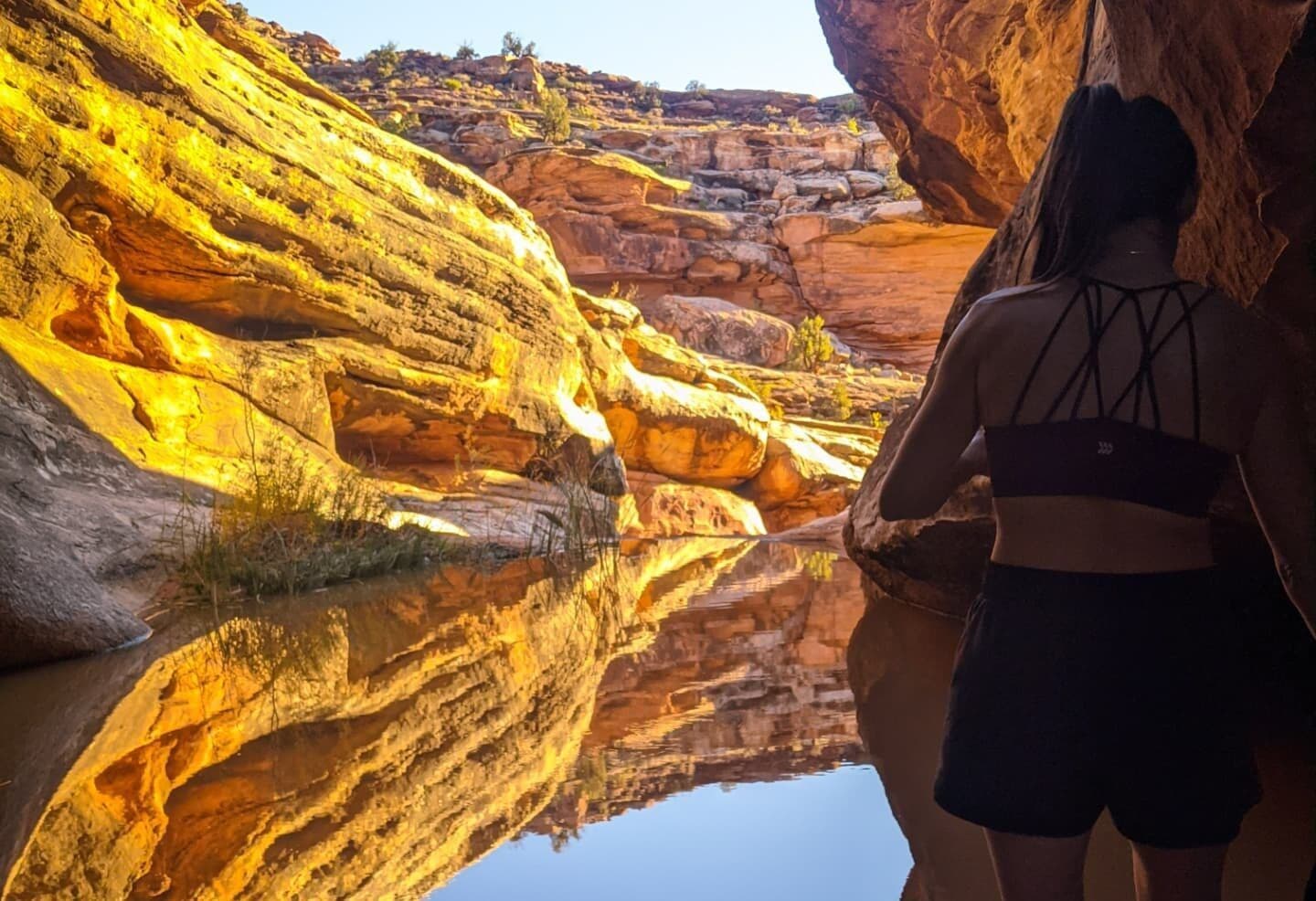 Woman looking at water in canyon
