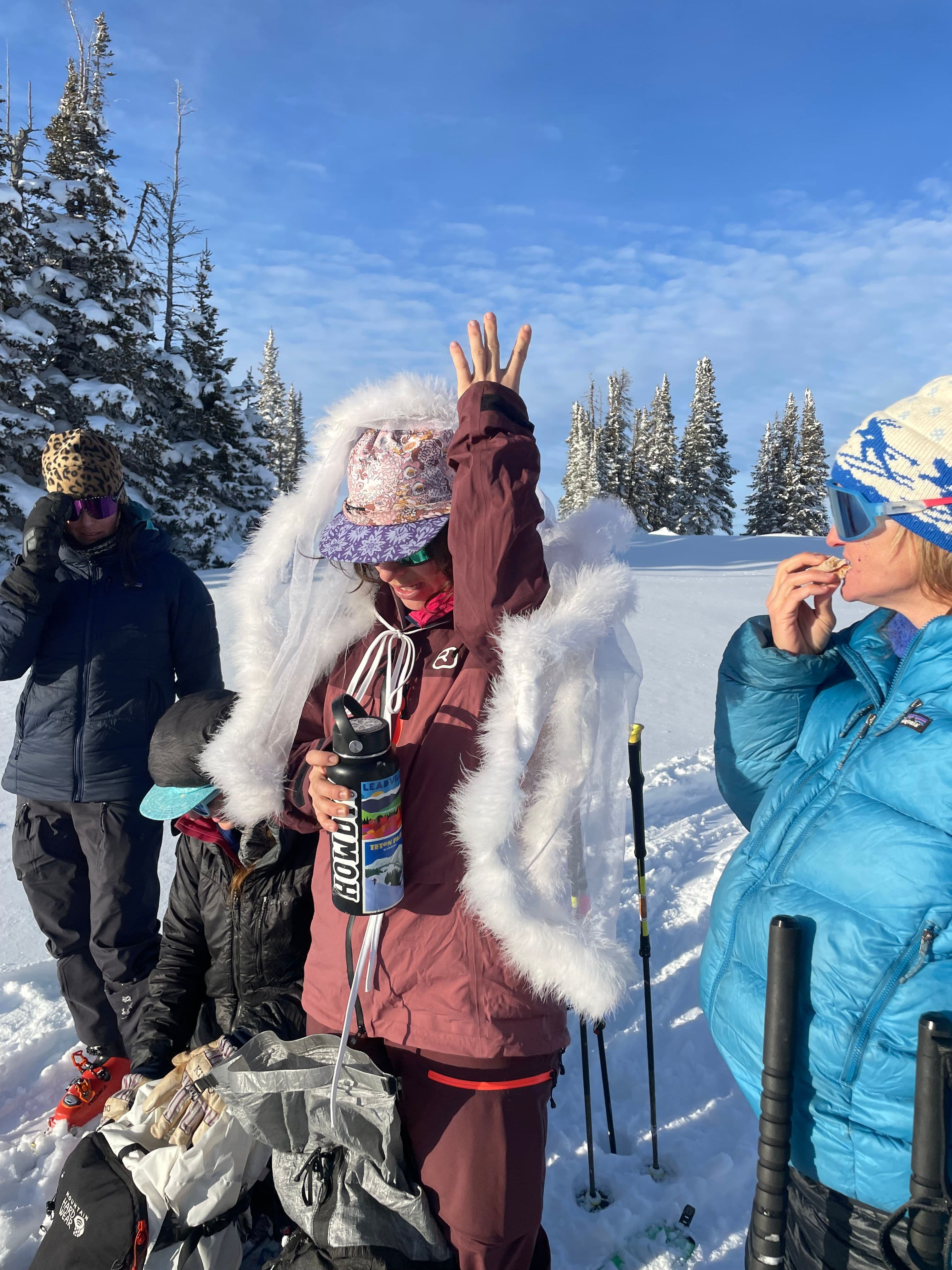 Women carving down a mountain