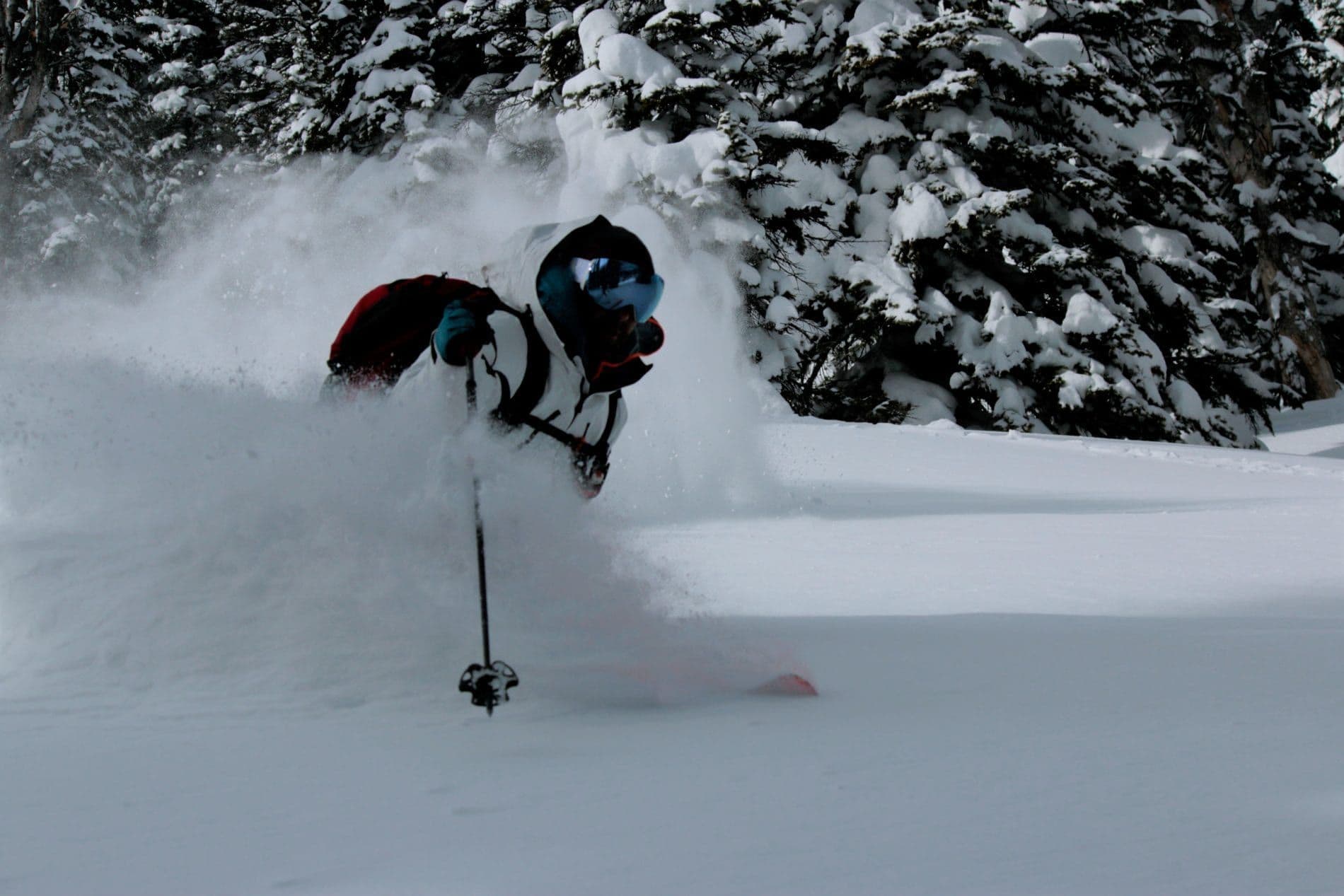 Skier maneuvering deep powder