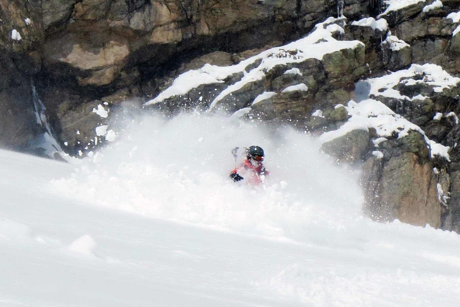 Person backcountry skiing in deep powder