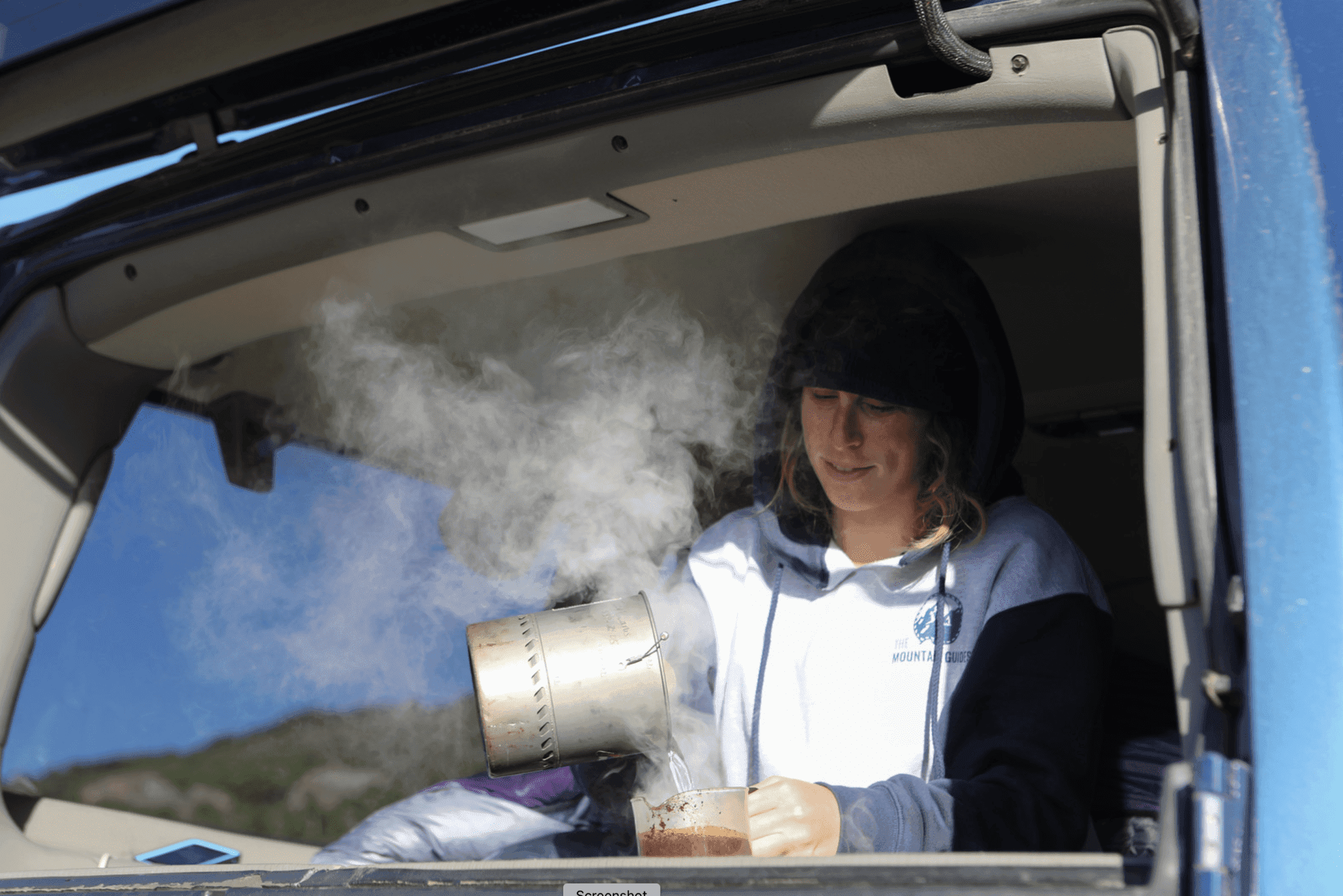 Woman pouring coffee in the morning