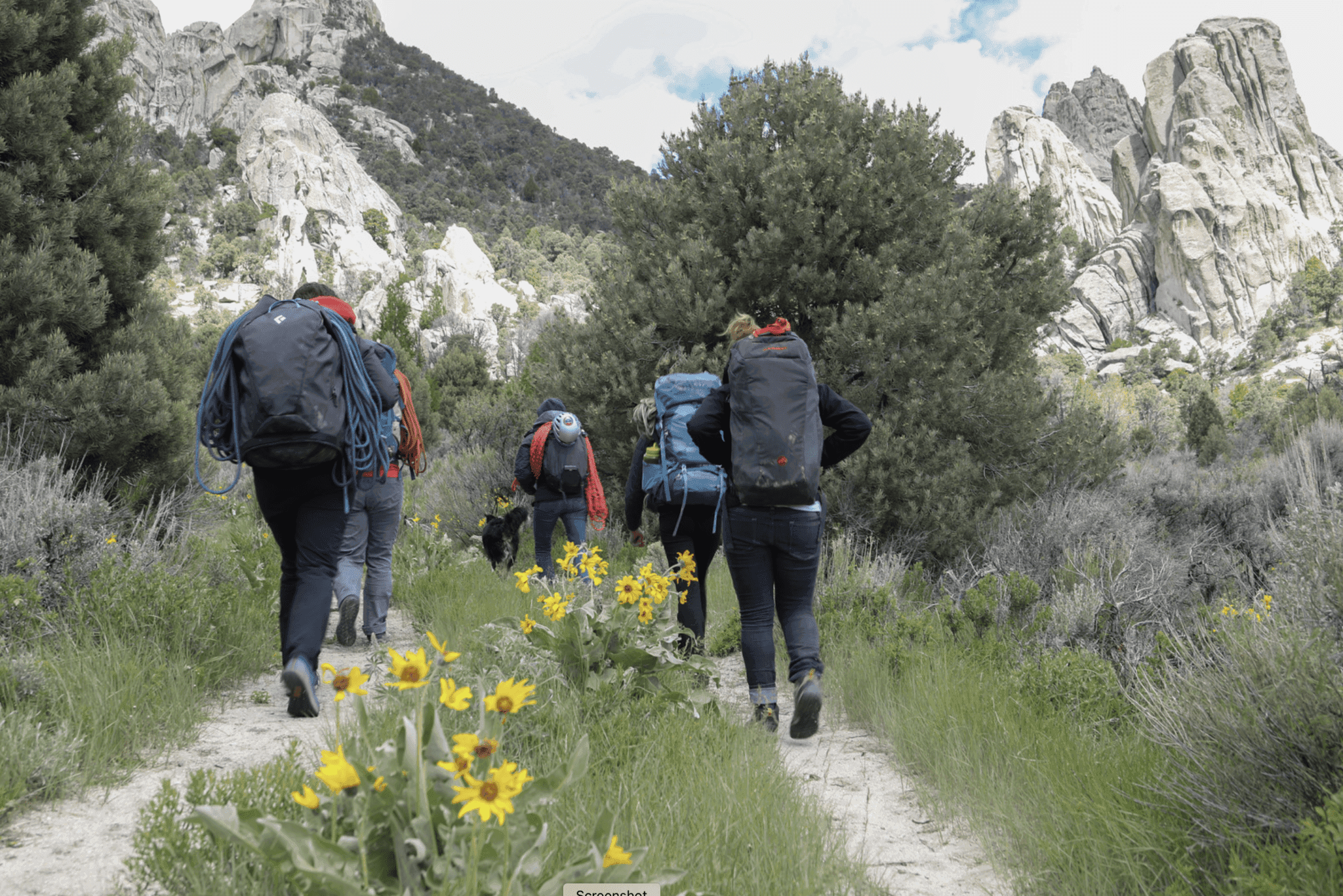 Group of hikers on trail in rock city