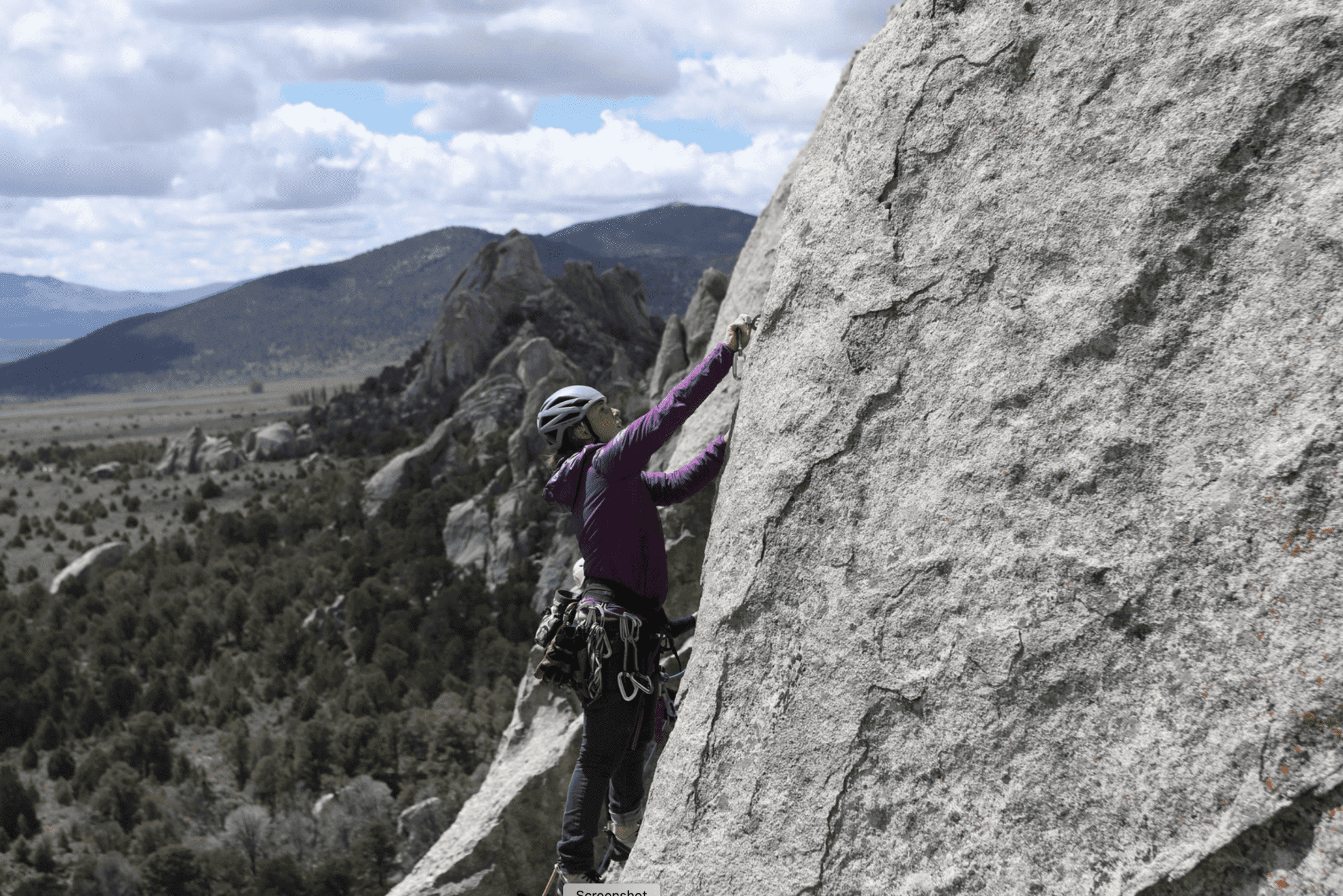 Woman rock climbing in city of rocks