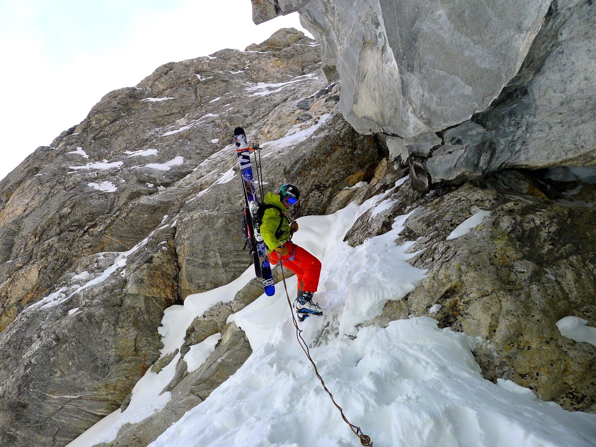 Skier climbs mountain