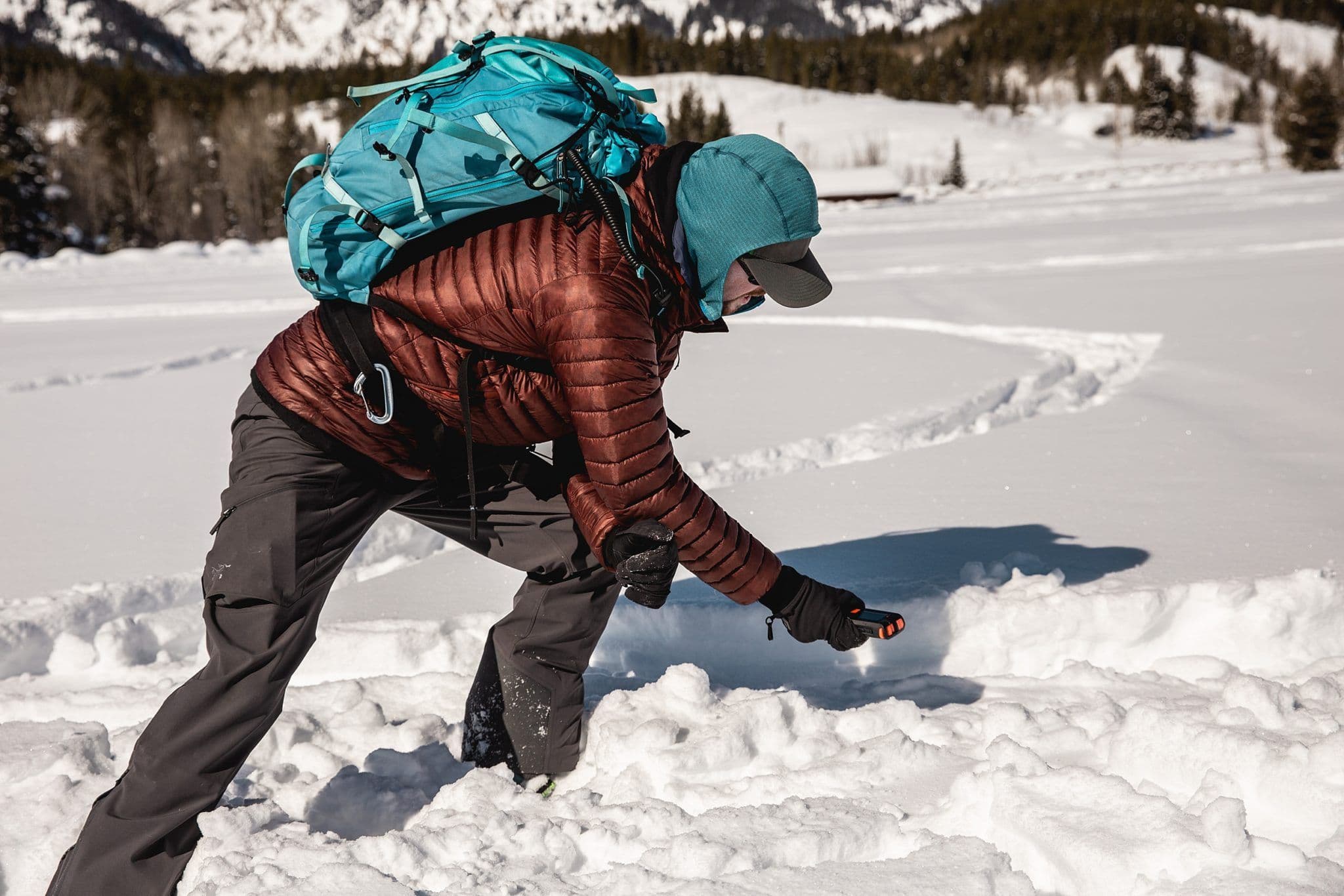 Person using device on avalanche course